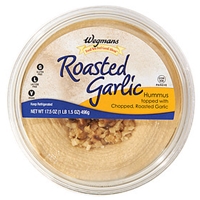 Wegmans Mediterranean Food Roasted Garlic Hummus Topped With Chopped, Roasted Garlic Food Product Image